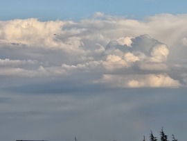 Felhő szivárvánnyal Szombathely felett Kőszegről nézve